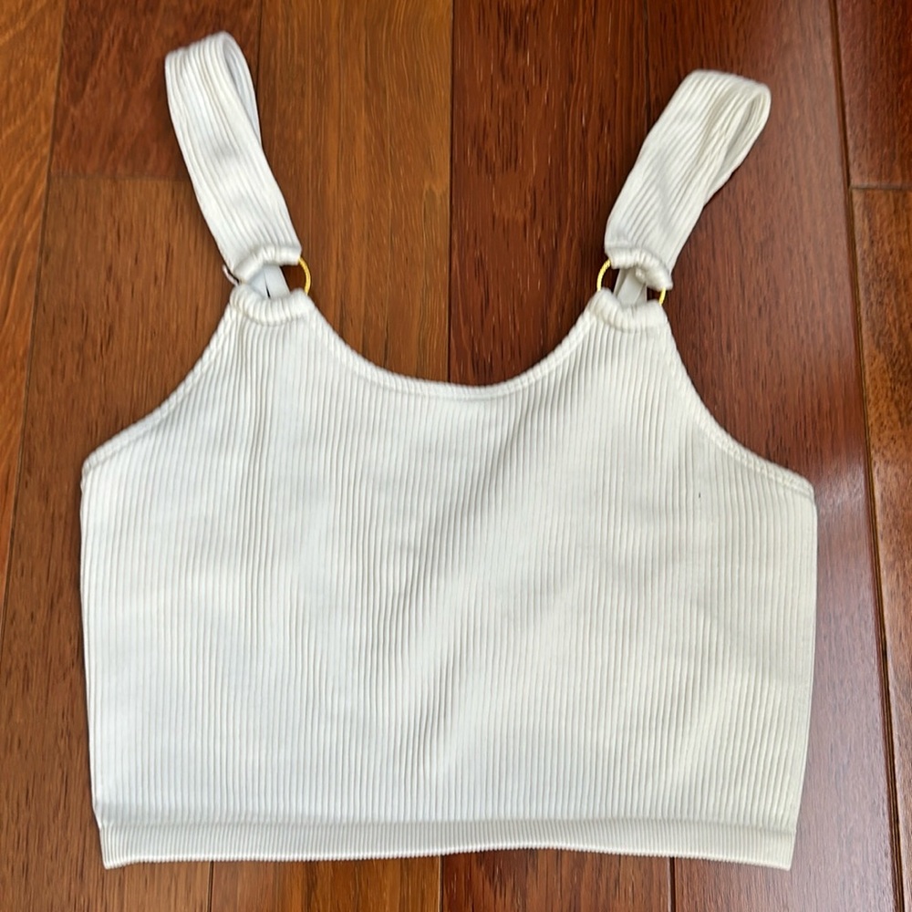 Aerie white shirt with built in bra. Gold accents and adjustable straps. Size XS